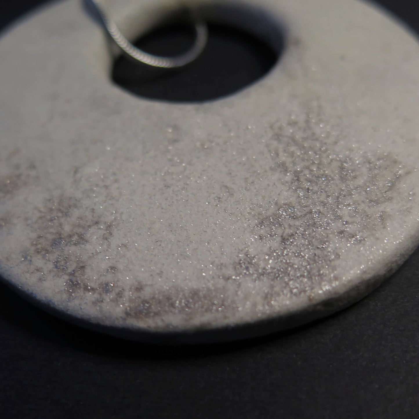 Eclipse stone with silver dust on adjustable length silver snake chain necklace with bar pendant ends