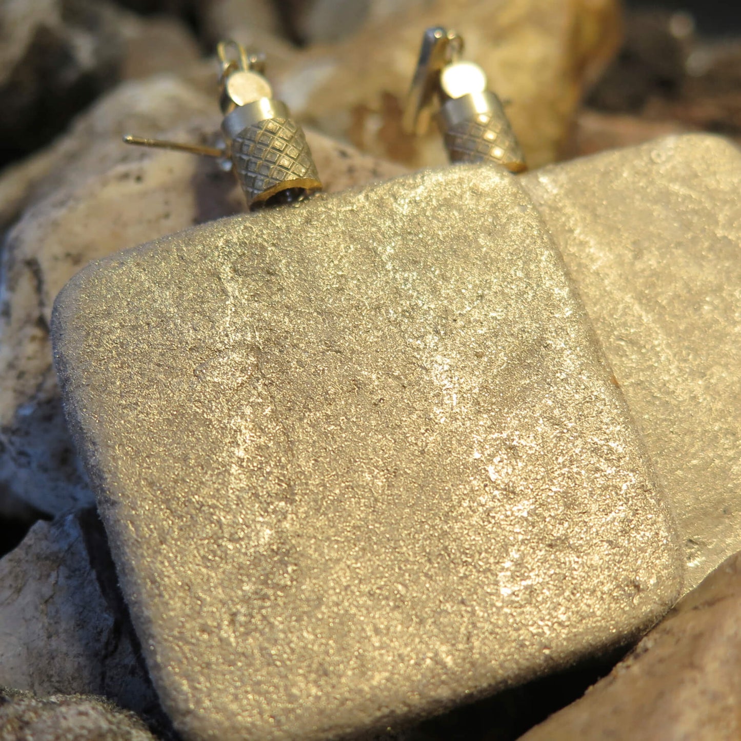 Gilded stone slab earrings with brass pineapple bead