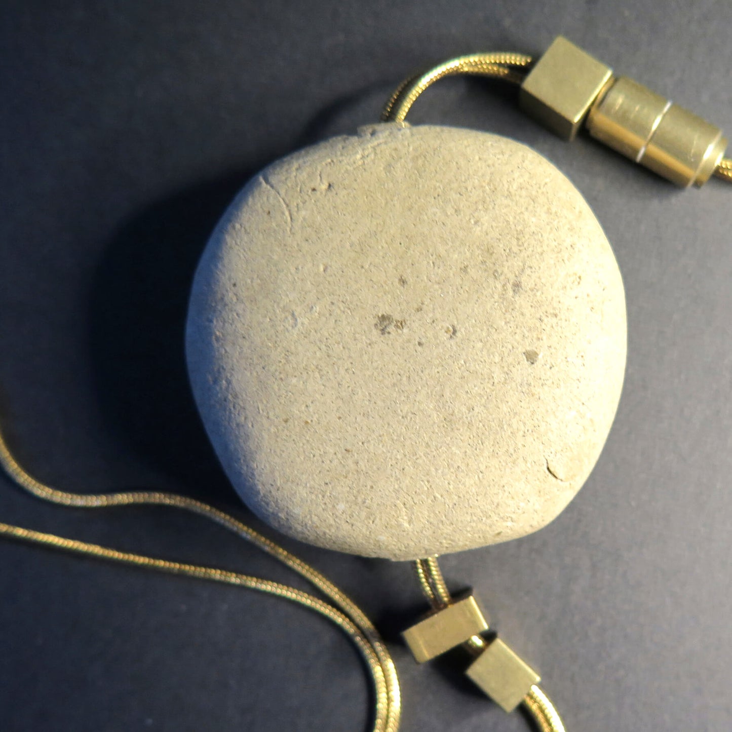 Natural sculpted pebble | Adjustable gold snake chain necklace with brass detailing