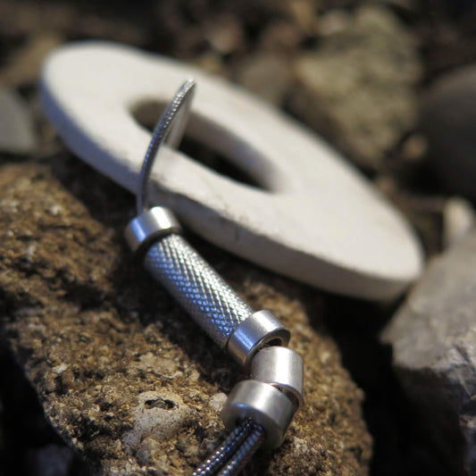 Eclipse stone with silver dust on adjustable length silver snake chain necklace with bar pendant ends