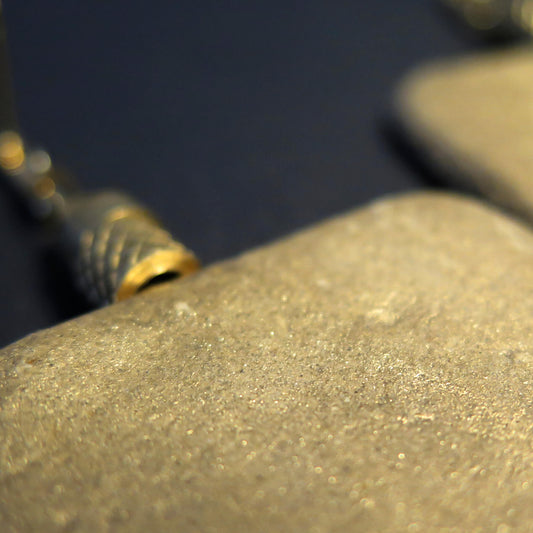 Gilded stone slab earrings with brass pineapple bead