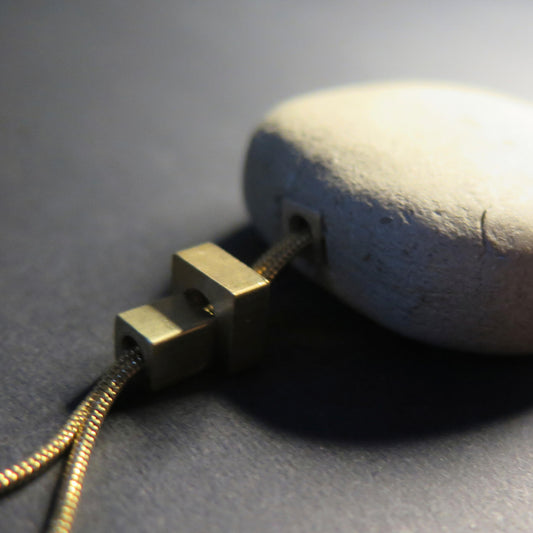 Natural sculpted pebble | Adjustable gold snake chain necklace with brass detailing
