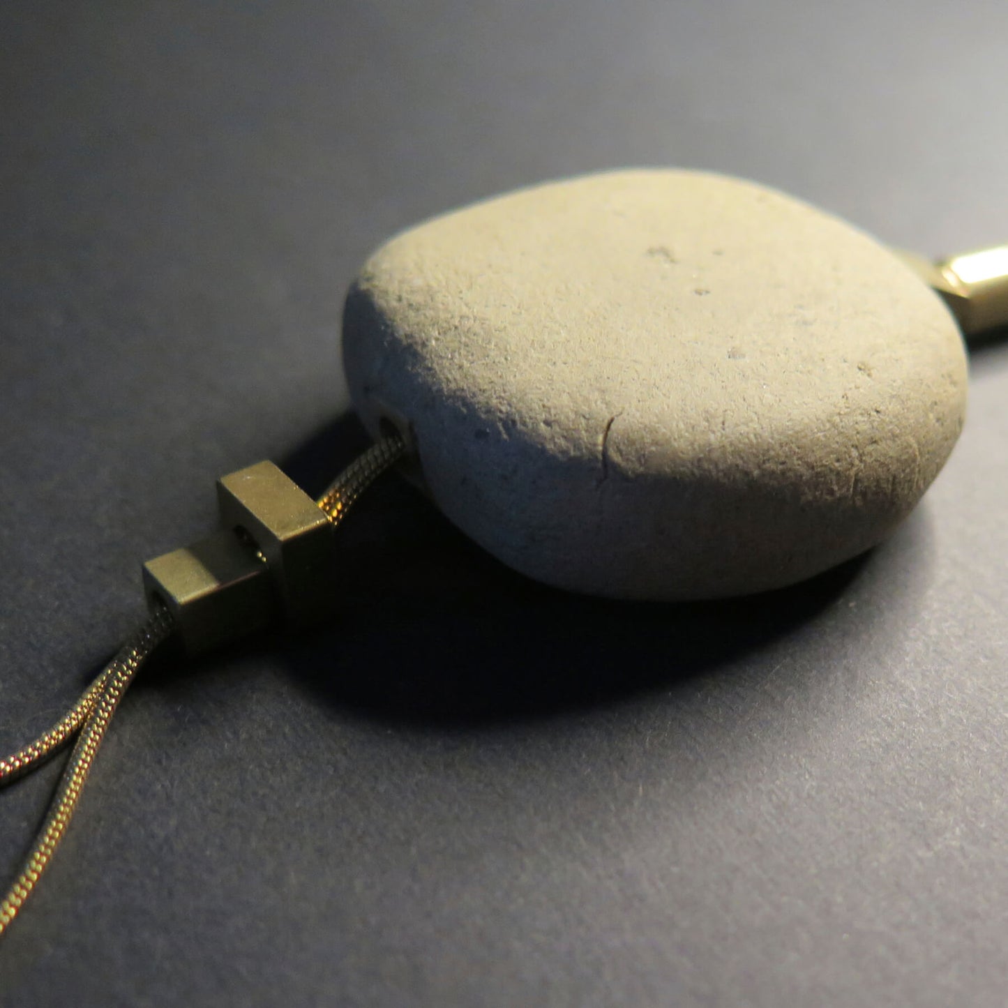 Natural sculpted pebble | Adjustable gold snake chain necklace with brass detailing